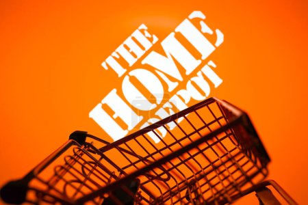Photo for March 31, 2024, Brazil. In this photo illustration, the Home Depot, Inc. logo seen displayed on a smartphone along with a shopping cart - Royalty Free Image