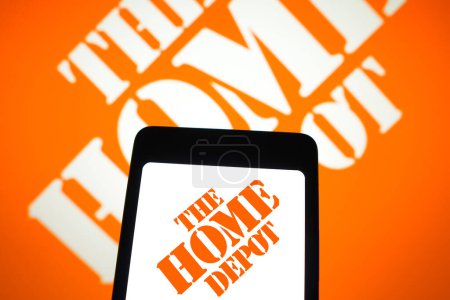 Photo for March 31, 2024, Brazil. In this photo illustration, the Home Depot, Inc. logo is displayed on a smartphone screen and in the background - Royalty Free Image