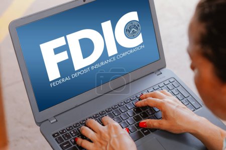 Photo for April 18, 2024, Brazil. In this photo illustration, the Federal Deposit Insurance Corporation (FDIC) logo is seen displayed on a laptop screen - Royalty Free Image