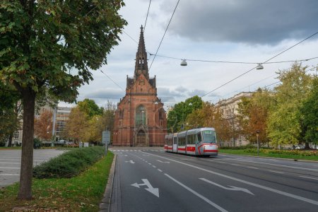 Photo for Red Church and Brno Tram - Brno, Czech Republic - Royalty Free Image