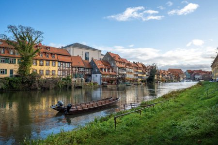 Photo for Regnitz River riverbank with small boats and old houses - Bamberg, Bavaria, Germany - Royalty Free Image