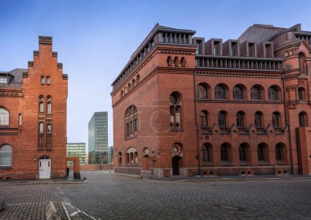 Photo for Brick buildings at Speicherstadt warehouse district with Modern Buildings of Dovenfleet on background - Hamburg, Germany - Royalty Free Image