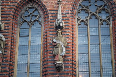 Photo for Aristotle Sculpture at Old Town Hall Facade - Bremen, Germany - Royalty Free Image
