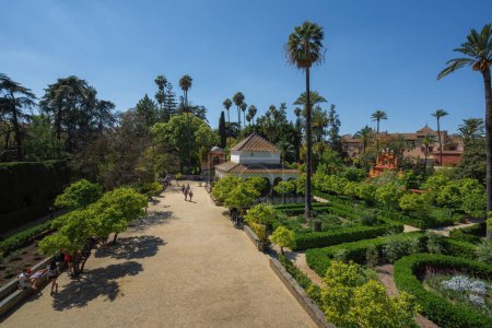 Photo for Seville, Spain - Apr 3, 2019: Garden of the Alcove (Jardin de la Alcoba) and Charles V Pavilion at Alcazar (Royal Palace of Seville) - Seville, Andalusia, Spain - Royalty Free Image