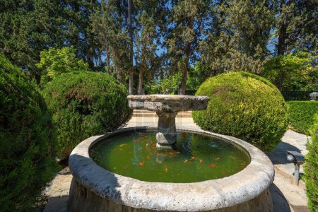 Photo for Seville, Spain - Apr 3, 2019: Fountain of Garden of the Poets (Jardin de los Poetas) at Alcazar (Royal Palace of Seville) - Seville, Andalusia, Spain - Royalty Free Image