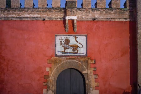 Photo for Seville, Spain - Apr 6, 2019: Lion Gate (Puerta del Leon) - Alcazar Main Entrance (Royal Palace of Seville) - Seville, Andalusia, Spain - Royalty Free Image