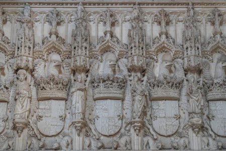 Photo for Toledo, Spain - Mar 27, 2019: Wall with Catholic Kings Coat of Arms at Church Interior in Monastery of San Juan de los Reyes - Toledo, Spain - Royalty Free Image