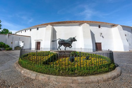 Photo for Ronda, Spain - Apr 28, 2019: Plaza de Toros (Ronda Bullring) and Monument to Spanish Fighting Bull - Ronda, Andalusia, Spain - Royalty Free Image