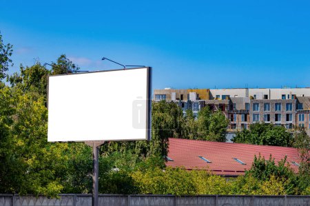 Photo for Billboard on the background of a house under construction. Billboard in the city. External advertising. Construction company. Property For Sale. Template for text. Building bussiness. - Royalty Free Image