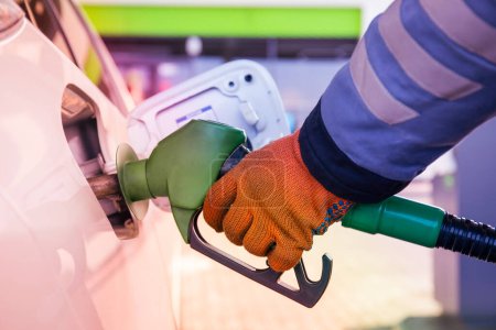 Photo for Refueling the car at a gas station fuel pump - Royalty Free Image