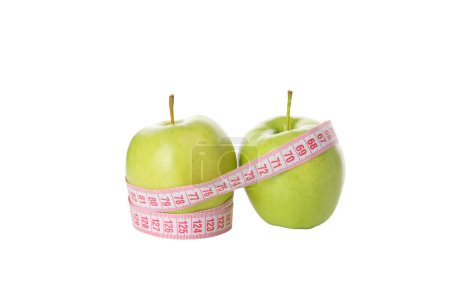 Photo for Concept of weight loss with apple and measuring tape, isolated on white background - Royalty Free Image