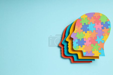 Photo for Paper human heads with colorful puzzle pieces on a light background, place for text. World autism day concept - Royalty Free Image