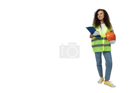 Photo for A girl in the form of a builder, isolated on white background - Royalty Free Image