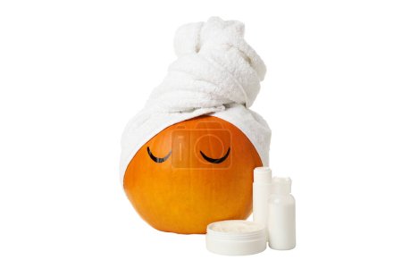 Photo for PNG, Pumpkin with a towel and skin care products, isolated on white background - Royalty Free Image