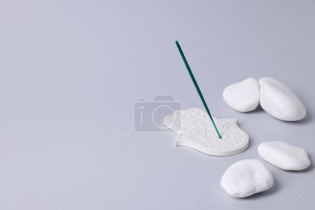 Photo for Incense stick and white stones on gray background, space for text - Royalty Free Image