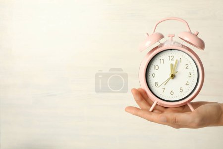 Photo for A beautiful watch in the hand on a light background - Royalty Free Image