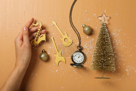 Photo for Musical instruments with Christmas tree and clock. - Royalty Free Image