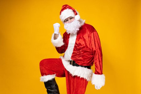 Téléchargez les photos : Père Noël se réjouit de la réussite des affaires. - en image libre de droit