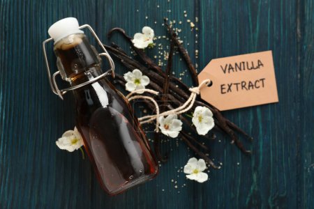 Vanilla extract in a bottle on a wooden table