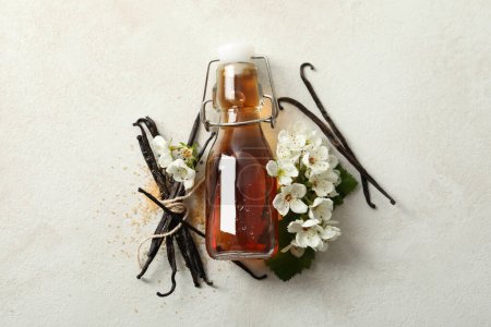 Vanilla extract in a bottle on a white background