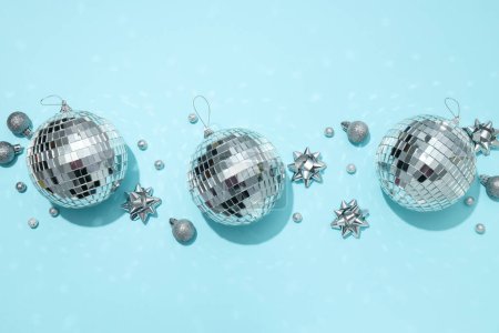 Disco balls with decorations on a light background
