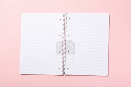 Photo for Open notepad on pink background, top view - Royalty Free Image
