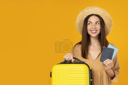 A young girl with a suitcase and a passport, on a yellow background.