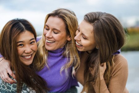 Photo for Three female friends hugging each other - Royalty Free Image