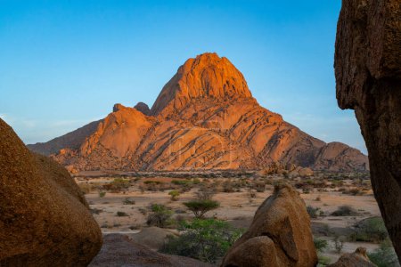 The Spitzkoppe at Sunrise. A group of bald granite peaks between Usakos and Swakopmund in the Namib desert of Namibia just after sunrice . It is  The Spitzkoppe.