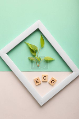 Photo for White frame and sprout on a fresh green background.. Mock up photo frame. Save the planet consept, eco friendly lifestyle. - Royalty Free Image