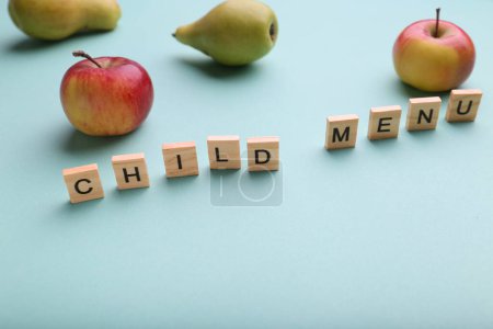 Photo for Kid's menu lettering on a light background. Fruit and the need for vitamins. Balanced baby food concept. Food in kindergarten and school. Caring for a child. No fast food, fruits instead of sweets. Health benefits of the child. - Royalty Free Image