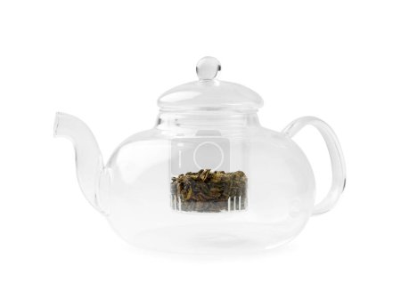 Photo for Empty glass transparent teapot and dry green tea in it on a white background. Utensils for making tea. - Royalty Free Image