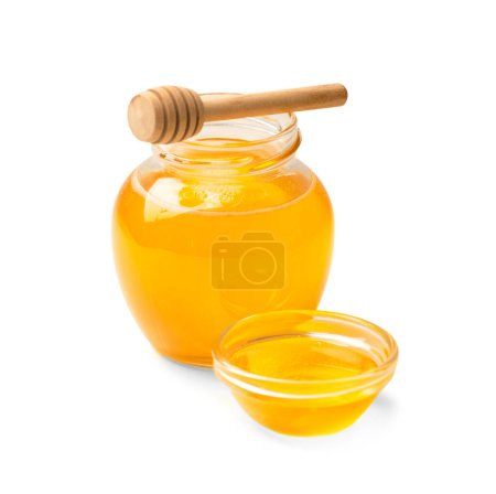 Photo for Organic honey in a glass jar and a transparent bowl, wooden dipper on a white background. Spoon for honey and fresh honey in an open jars on isolation close-up. Healthy products. - Royalty Free Image
