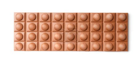 Foto de Gran barra entera de chocolate con leche con nueces sobre un fondo blanco, chocolate sobre blanco vista superior aislada. - Imagen libre de derechos