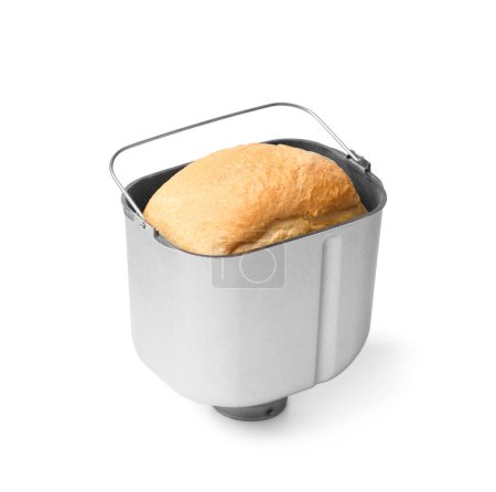 Photo for Fresh homemade bread with a crispy crust, cooked in an automatic bread machine is inside a baking dish, isolated on a white background. - Royalty Free Image
