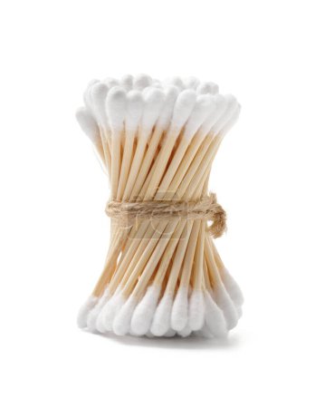 Photo for Wooden cotton swabs buds are tied with natural twine, isolated on a white background. The concept of hygiene items from natural, environmentally friendly, biodegradable materials. - Royalty Free Image
