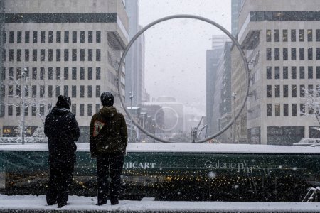 Photo for Montreal, Canada - 16 November 2022: Ring art piece in Downtown Montreal suring snow storm - Royalty Free Image