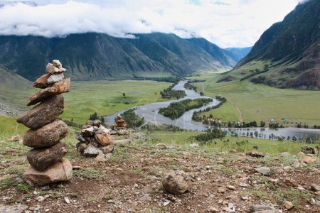 Stone pyramid in river valley Chulyshman. Natural mountain landscape Republic Altai, Russia, summer day. tourist place. High quality photo
