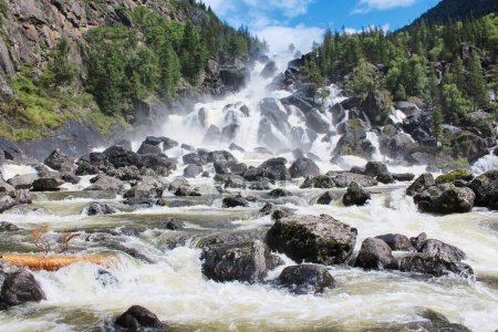 Photo for Big Chulchinsky waterfall in Altai reserve, Siberia, Russia. Famous landmark Uchar at summer sunny day. Fall of water between large stones in the forest. High quality photo - Royalty Free Image
