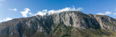Panorama of rocky mountain, blue sky with white clouds. Natural landscape, scenery. Summer South Africa nature, banner, header