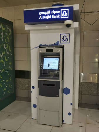 Photo for MECCA, KINGDOM OF SAUDI ARABIA-JUNE 4, 2023: Al Rajhi automated teller machine (ATM) kiosk at Abraj Al Bait tower in Makkah, Saudi Arabia. - Royalty Free Image