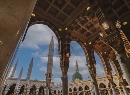 Photo for General view green dome and Moorish pattern arches of Nabawi mosque in Al Madinah, Kingdom of Saudi Arabia. - Royalty Free Image