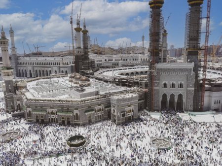 Photo for Bird's eye view of Muslim pilgrims exit Masjid Al Haram Mosque via numerous gates in Makkah, Saudi Arabia. Haram Mosque is the holiest mosque in Islam - Royalty Free Image