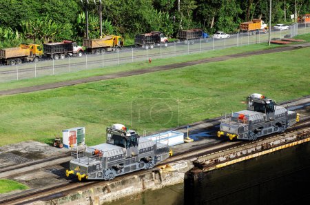  Engine operator secured to a vessel going up the lock on the Panama Canal,