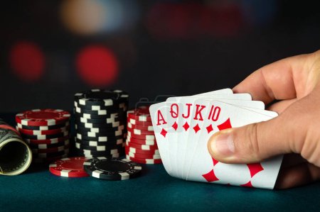 Photo for Poker cards with royal flush combination in the player hand. Lucky combination in a game in a poker club. Max win depends on luck - Royalty Free Image