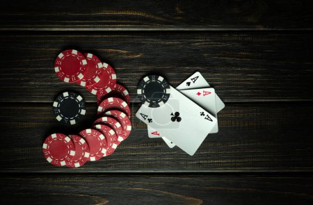 Photo for Poker gambling concept. Playing cards with a winning combination of three aces. Luck in playing cards depends on fortune or prophecy. - Royalty Free Image