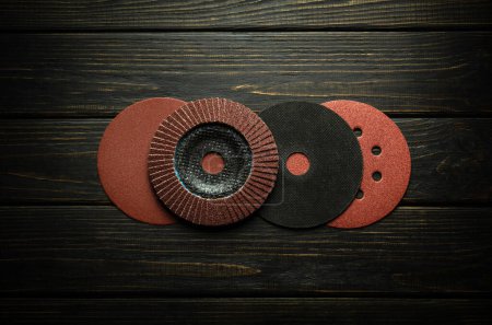 Photo for A set of professional wheels and carpentry tools for polishing and cleaning boards or whetstones. Abrasive tools and sandpaper. - Royalty Free Image