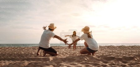 Photo for Happy asian family enjoy the sea beach. father, mother and daughter having fun playing beach in summer vacation on the ocean beach. Happy family with vacation time lifestyle concept. - Royalty Free Image