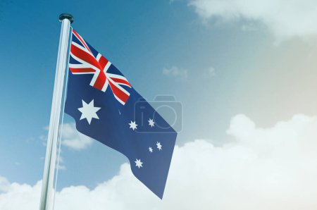 Australian flag against blue sky illustration image