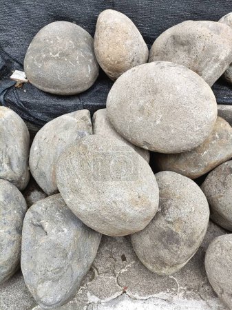 Photo for Vertical pile of natural gray river rocks abstract background pattern - Royalty Free Image